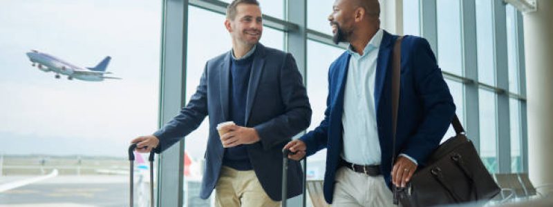 Travel for business, team at airport and men, catch flight for work trip with conference or training seminar with accountant. Walk, talk and diversity with finance convention and partnership